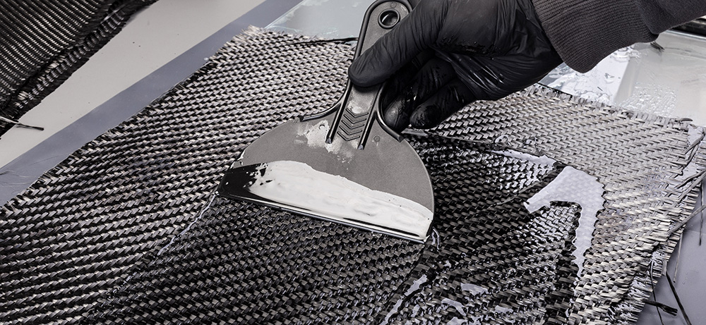 epoxy-resin-into-woven-carbon-fiber-reinforcement-cloth